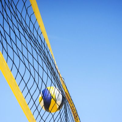 40818734 - beach volleyball caught in the net.
